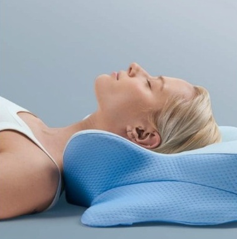 Derila Ergo contoured memory-foam pillow supporting a sleeper's head and neck